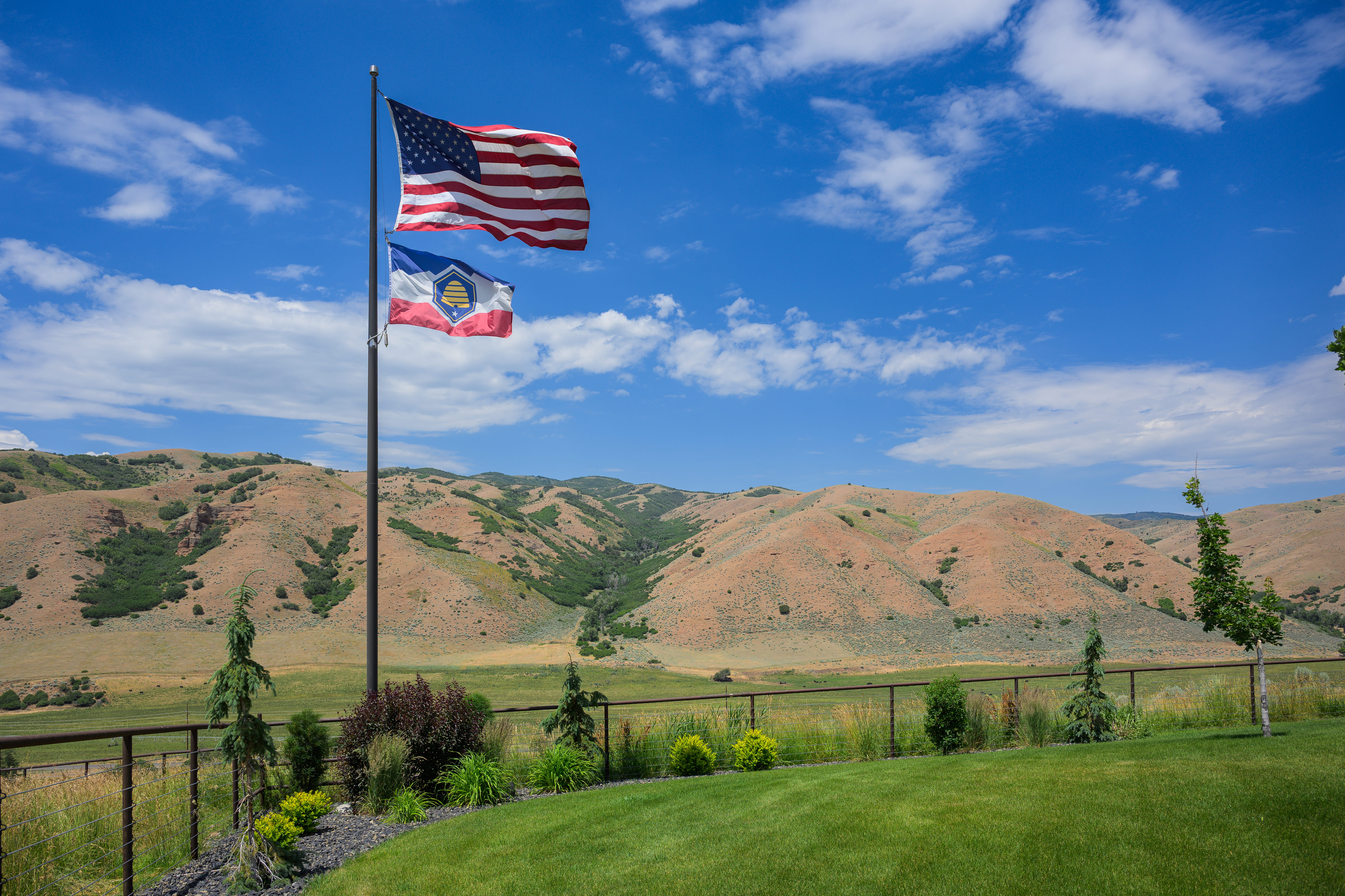 American flag and Utah state flag at Sawmill Ranch.